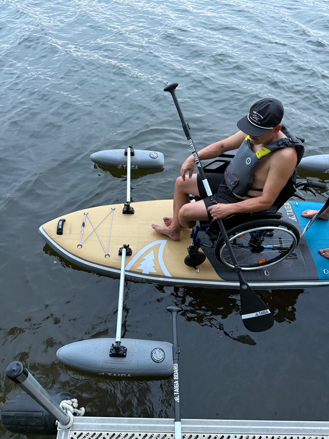 Upper View of a Paddler On a Wheelchair On The Adaptive SUP