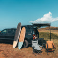 Longboard 9'0" Surf Board Leaning on a Camping VAN
