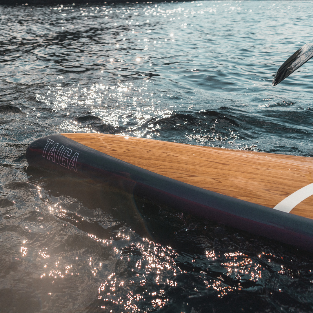 Nose of the Kazuzu 12'6 blue on a lake