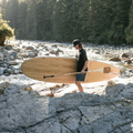 Paddler holding the Performance Root Collection Paddle by TAIGA