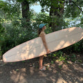 Side View of the girl wearing the Dad Hat Surf & Paddle in Dark Mint Color
