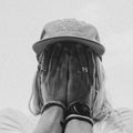 Black and White picture of a girl wearing the Dad Hat Surf & Paddle in Grey