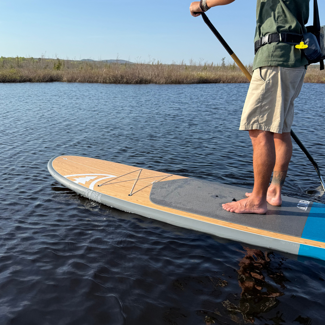 Side View of a Paddler On The Borea 10'6" in Color Sea Blue 