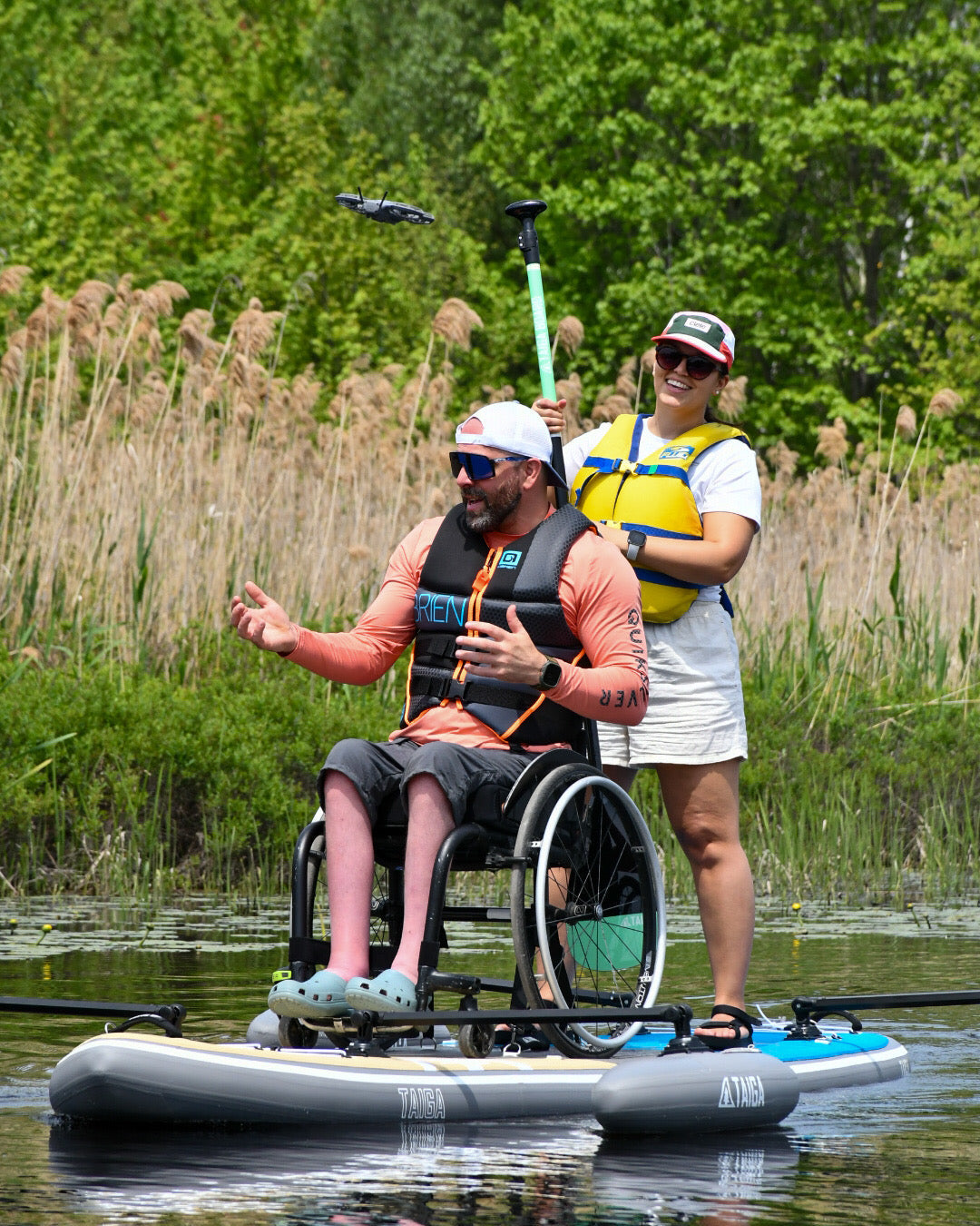 Two paddlers on the TAIGA Adaptive SUP