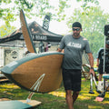 Paddler holding the Kazuzu 12'6 Pine