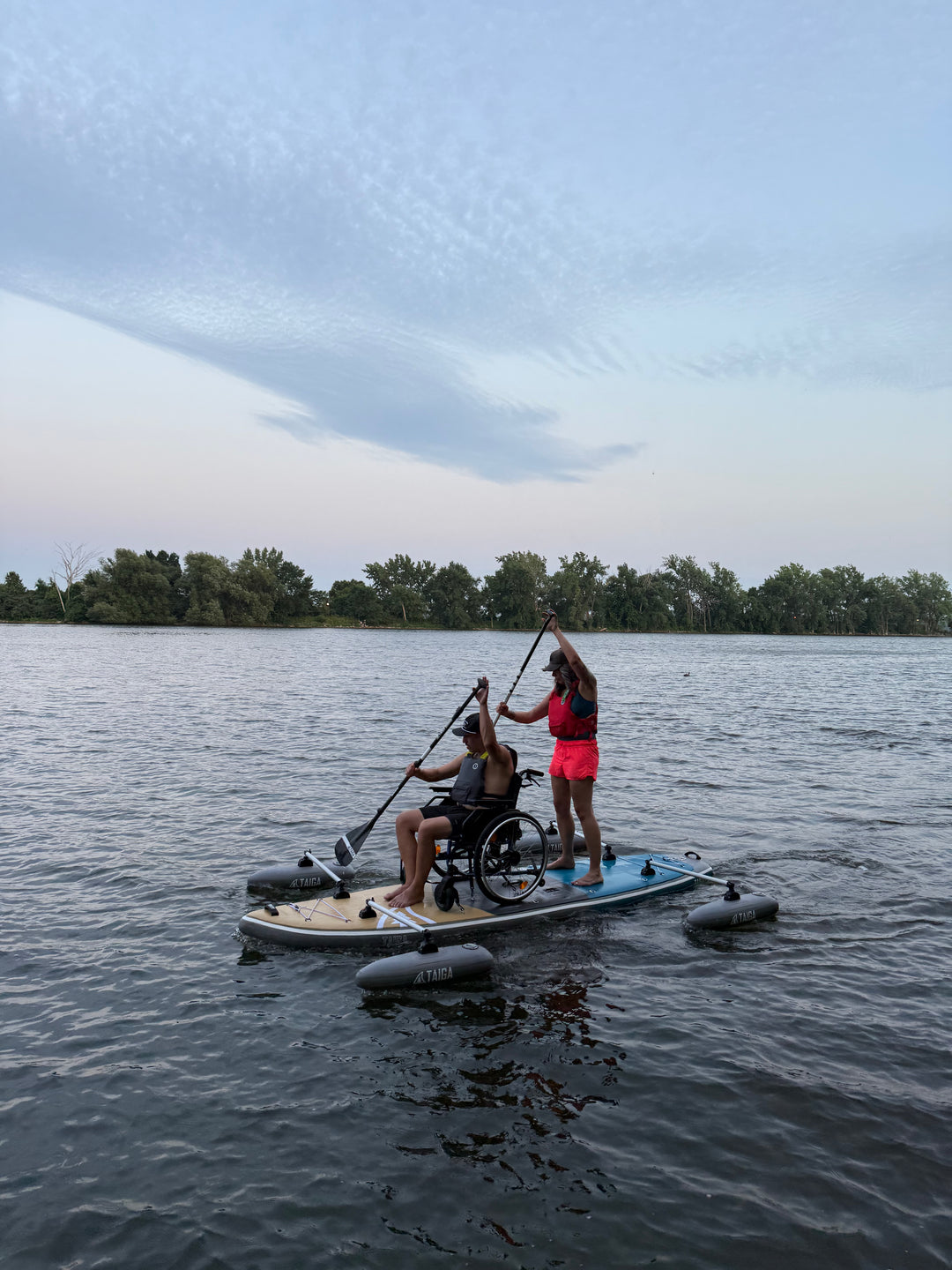 2 paddlers on The Adaptive SUP