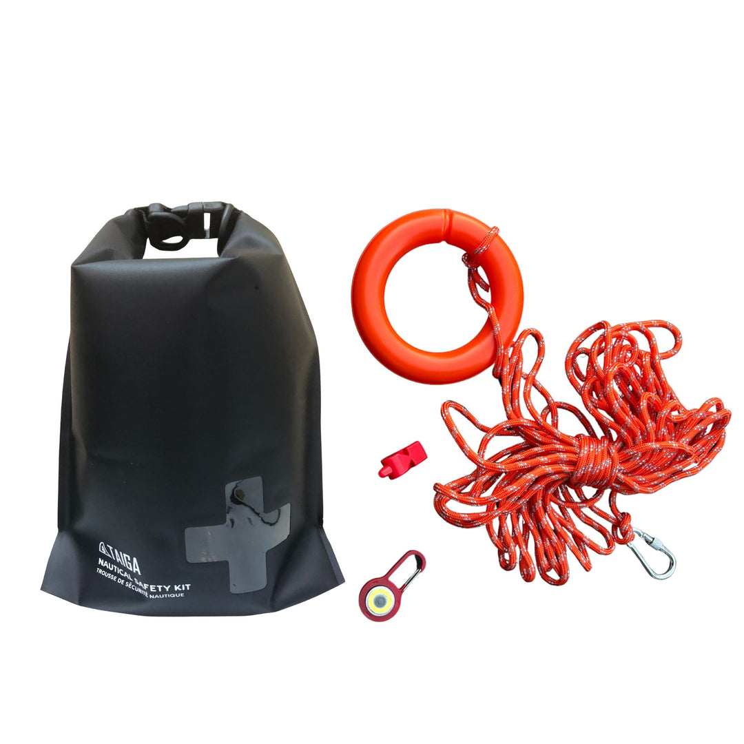 Black dry bag, red life ring, and rope on a white background