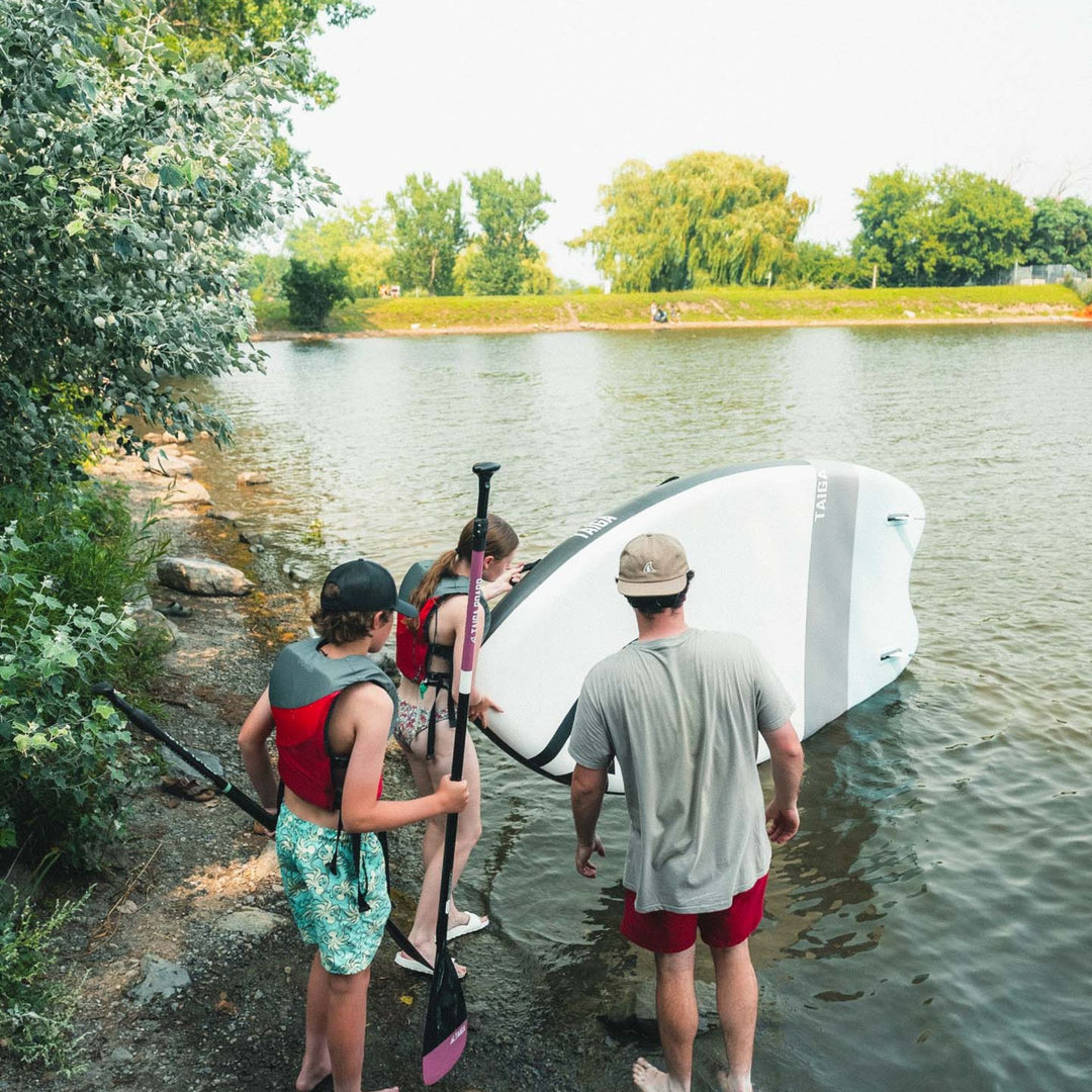 Paddlers holding the Sequoia Air 13'6" Light Construction
