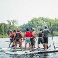2 groups of people paddling on the Sequoia Air 16'5" Party SUP