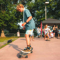 Kid skateboarding on the Surfskate By TAIGA