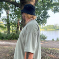 Side View of a man wearing the Boxy Fin T-Shirt
