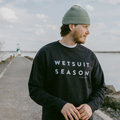 Man wearing the WETSUIT SEASON CREWNECK - blue