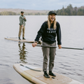 Paddlers laughing & wearing the WETSUIT SEASON CREWNECK - blue