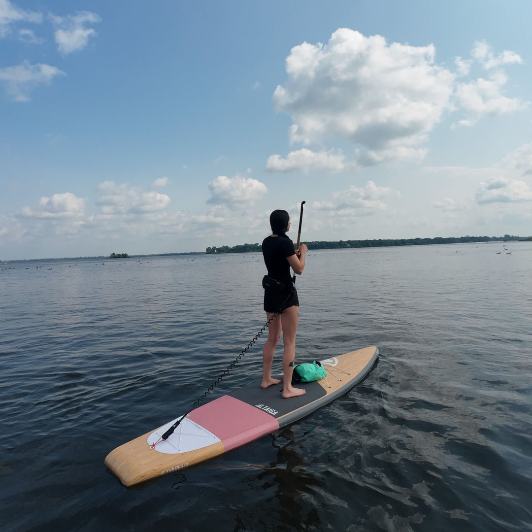 Girl Paddling On The Kazuzu 12'6" in Color Dusty Rose 