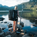 Paddler on a lake with the Nano Zip Air 9'8 - Compact SUP BAG