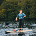 Burgundy Hybrid Paddle by TAIGA on a lake with the Akoya 9'5 Root Hard SUP
