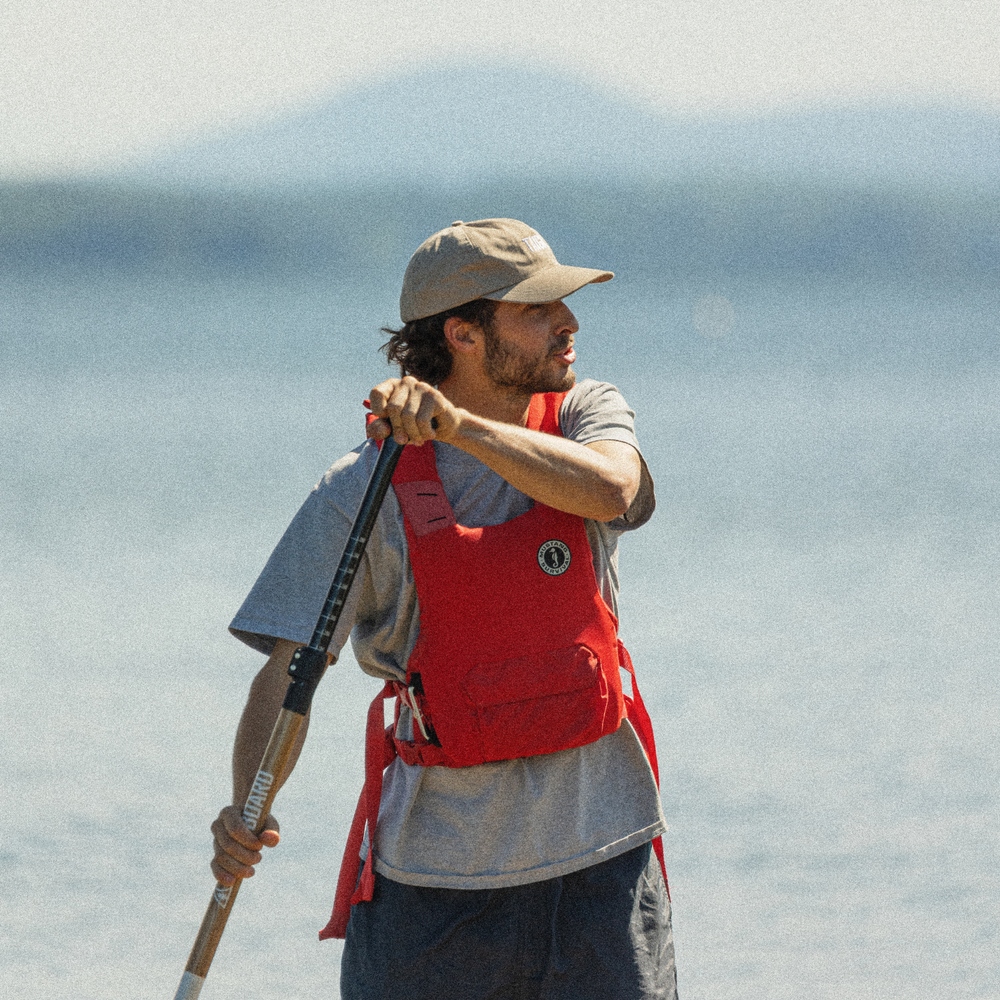 Paddler with the PFD Vest by MUSTANG - Red