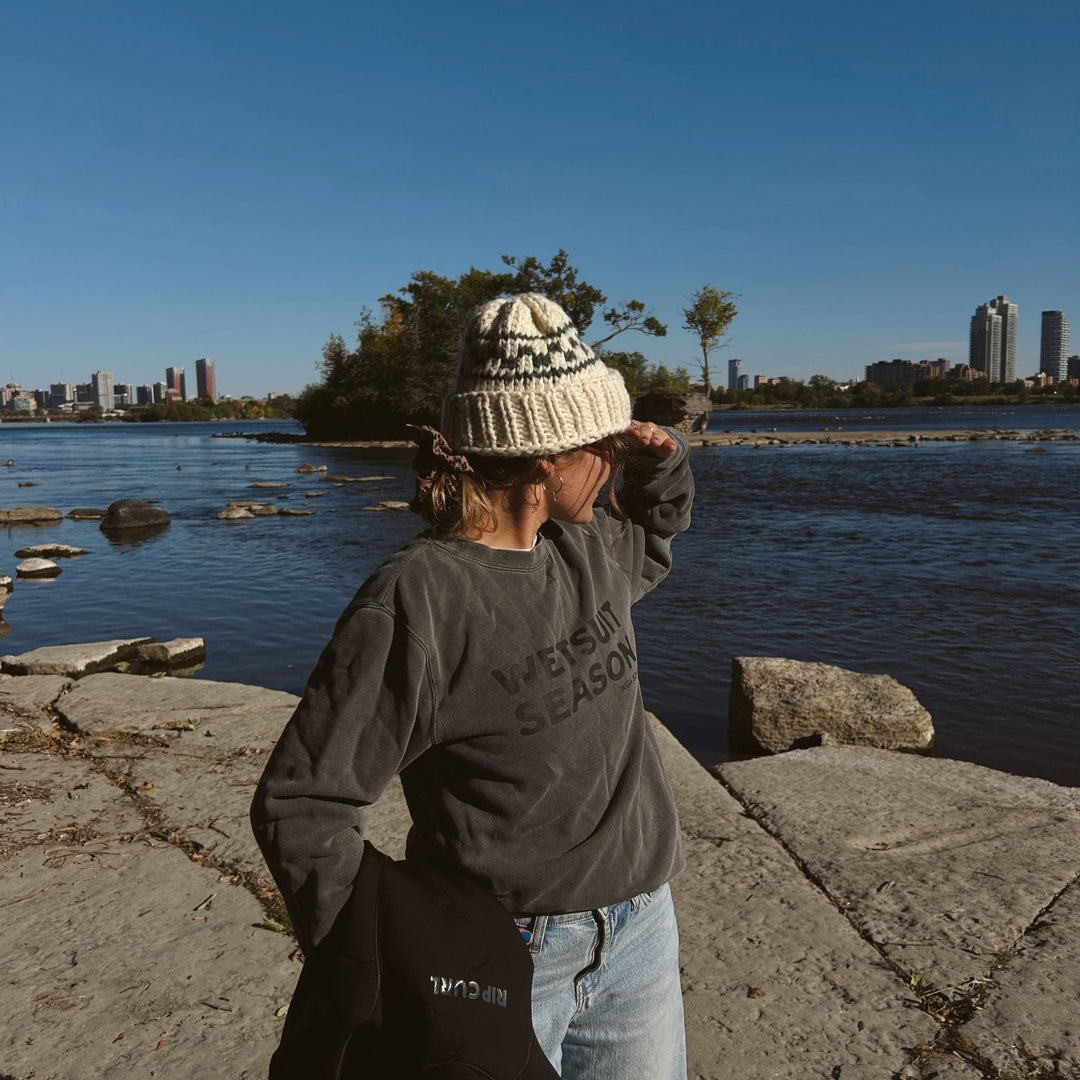 Girl with a beanie wearing a Wetsuit Season Crewneck