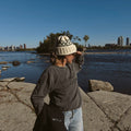 Girl with a beanie wearing a Wetsuit Season Crewneck