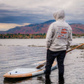 Paddler wearing a TAIGA BOARD hoodie in front of Mont Orford