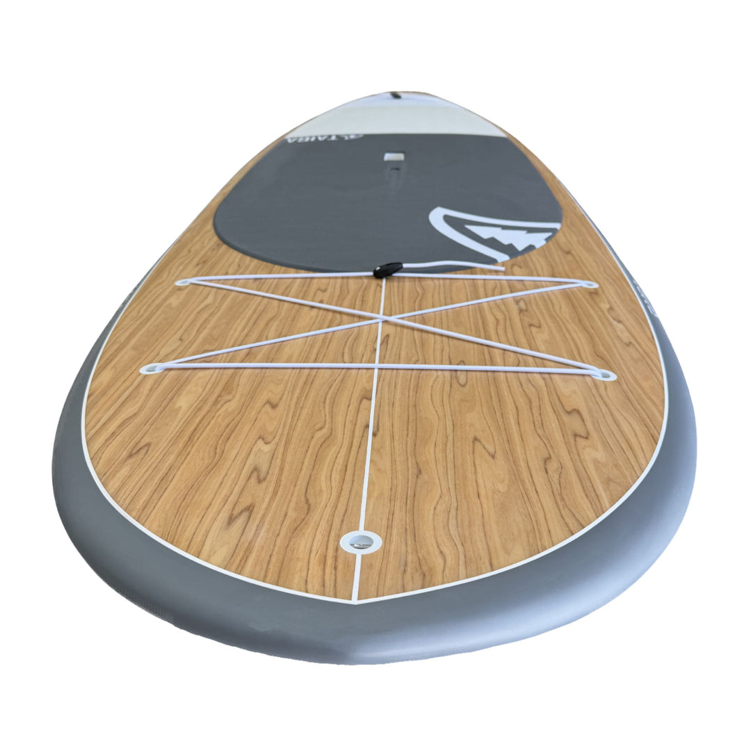 Nose of Wooden paddleboard with white logo on a white background