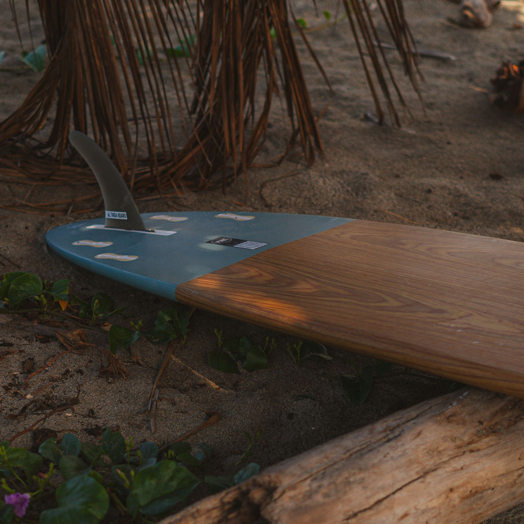 Wooden surfboard in the shade