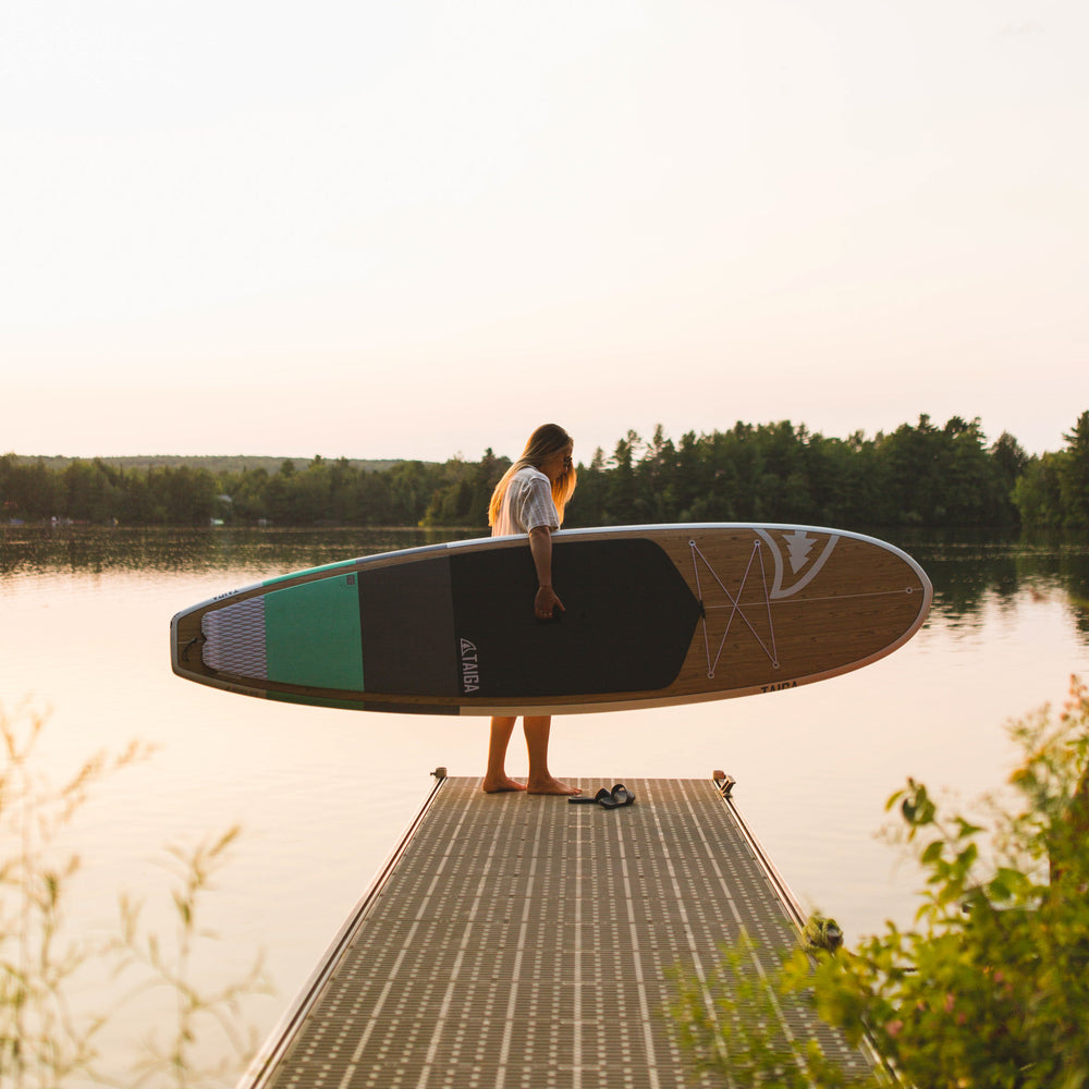 Girl holding the Borea 10'6 seafoam