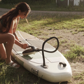 Girl inflating SUP with the Electric Pump 20 PSI by TAIGA
