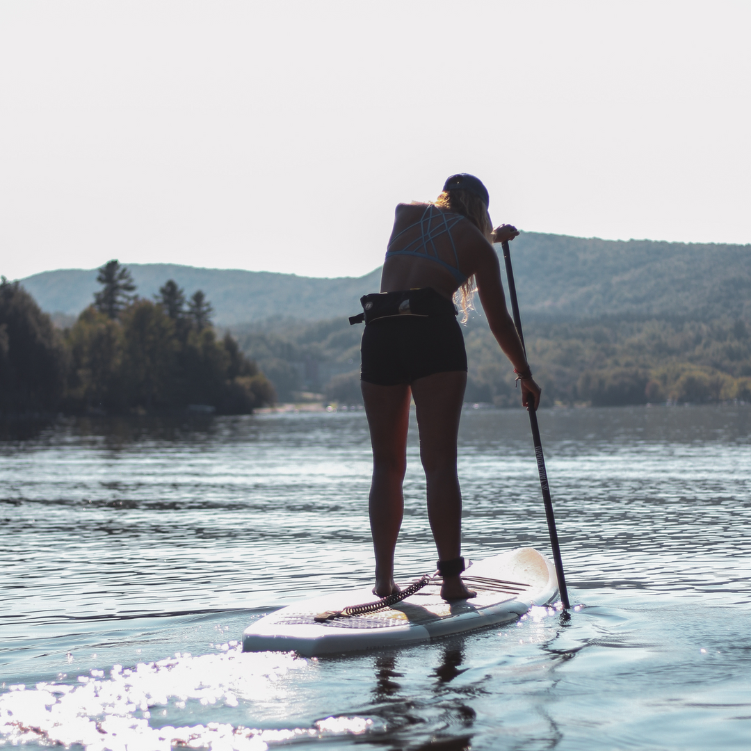 Paddler on a lake with the Kazuzu 12'6 green