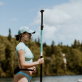 Paddler with the 2-piece Turquoise Hybrid Paddle by TAIGA