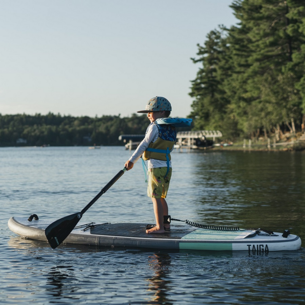 Boy paddling with the Nibi Kid Paddle by TAIGA