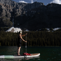 Paddler on a lake with the Performance Carbon Black 5 pieces Paddle for the Nano Zip Air 9'8 iSUP by TAIGA