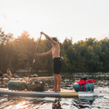 SUP camping - Paddler wearing the minimalist PFD Belt Pack by MUSTANG